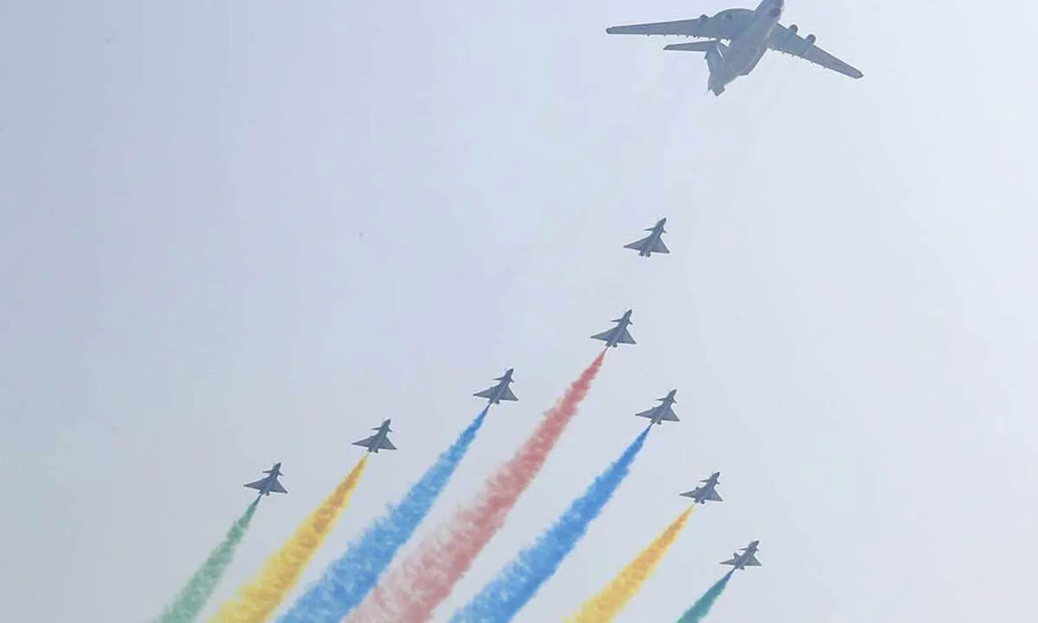 The KJ-2000 radar plane flies followed by the J-10 fighters