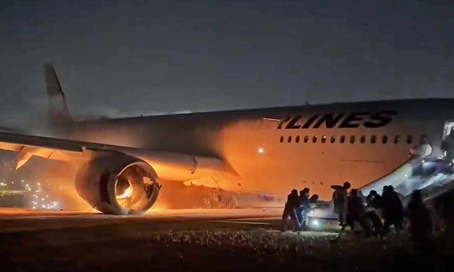 Passengers evacuate from A350 while right engine still runs (social media)