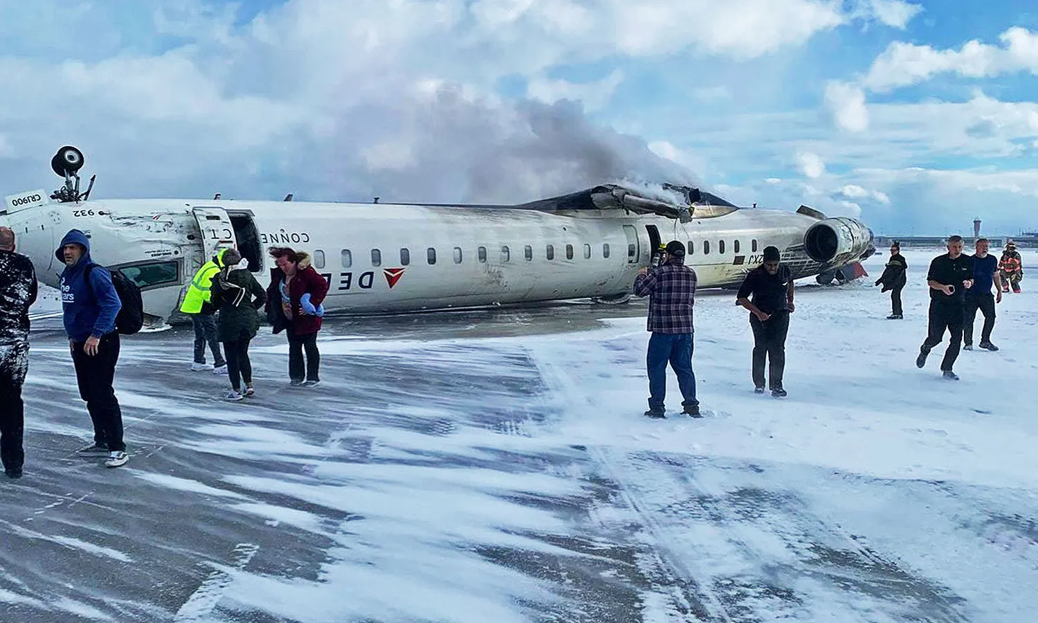 The CRJ-900 jet turned upside down after landing. Passengers left the aircraft through the emergency exit. (Social media)